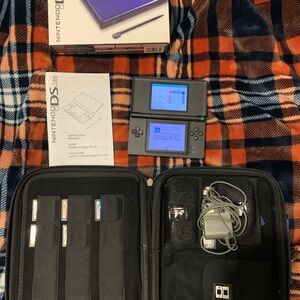 Nintendo DS Lite (Blue) with 9 games, charger, styluses and carrying case.